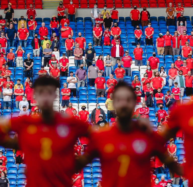 Wales fans sing the anthem during the international challenge match, Wales v Albania at the Cardiff City Stadium, Cardiff.