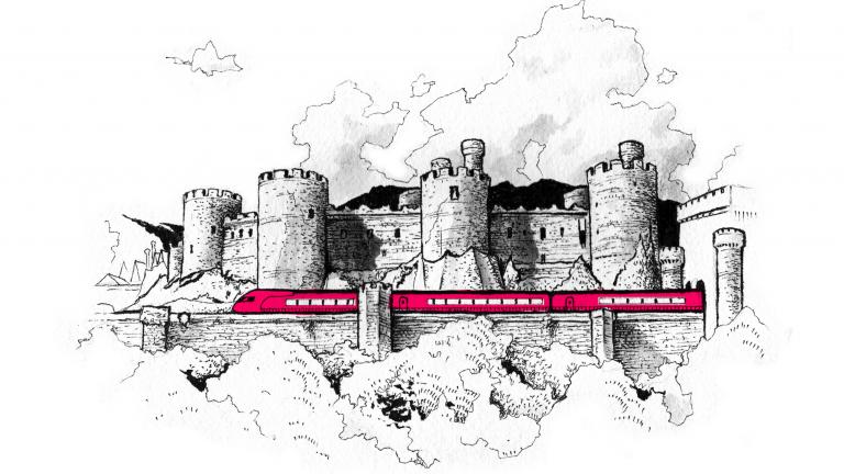 Train passing by Conwy Castle