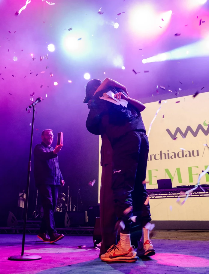 Two people performing on stage,