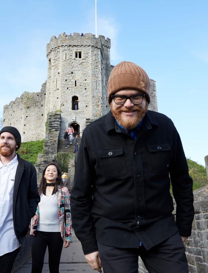 Huw Stephens looking down into camera at Cardiff Castle