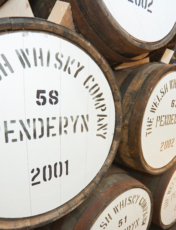 Casks of whisky at distillery Penderyn Welsh Whisky