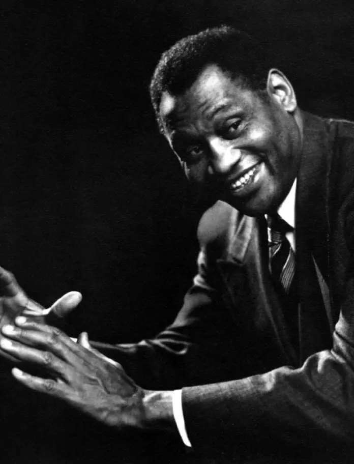 A black and white photograph of Paul Robeson