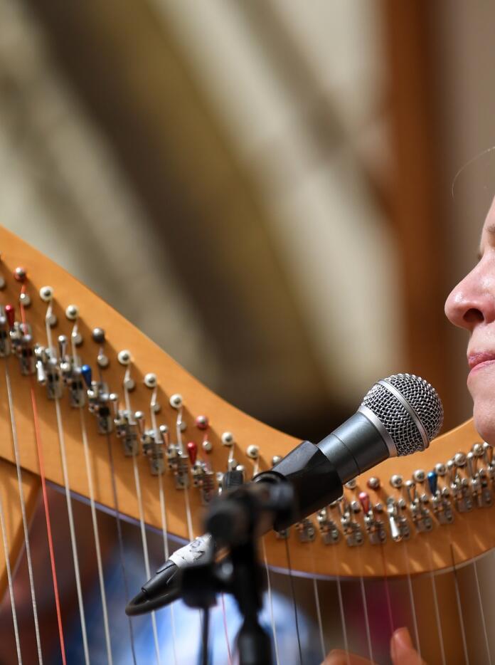 A person playing the harp.