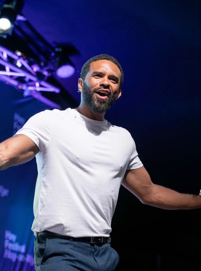 Alex Wharton speaking on a stage