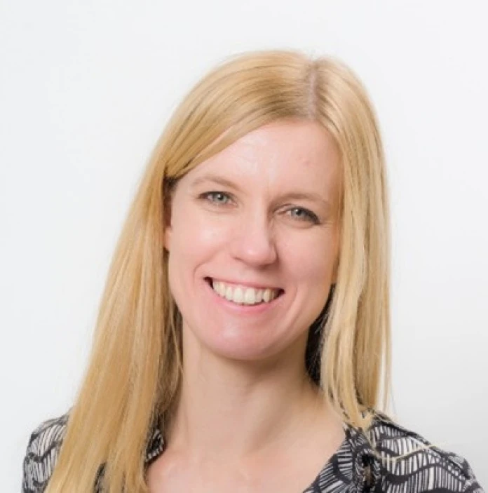 A headshot of Charlie smiling.