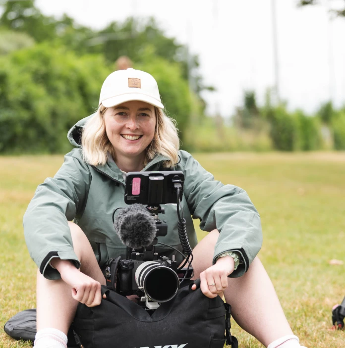 Photographer Betsan Haf Evans with her camera equipment during UEFA Women's EURO 2025 in Switzerland. 
