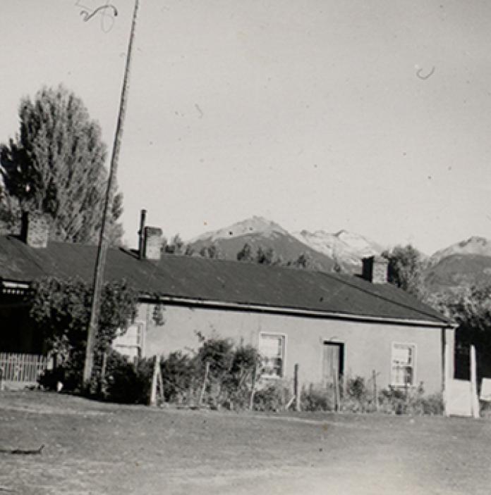 House with mountains of Patagonia in background.