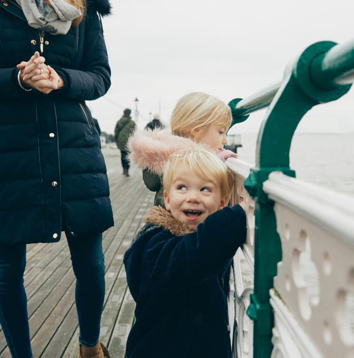 children on a pier 