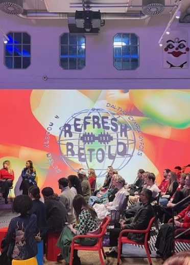 A panel discussion in a large bright room