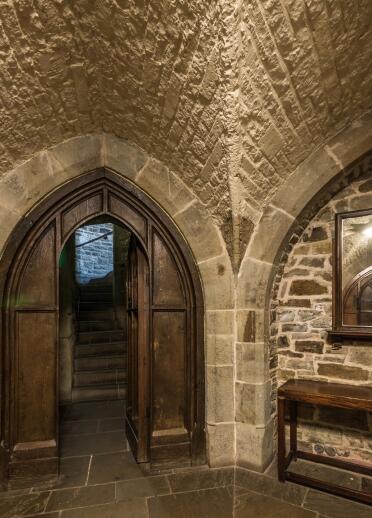 A room with stone walls and floors.