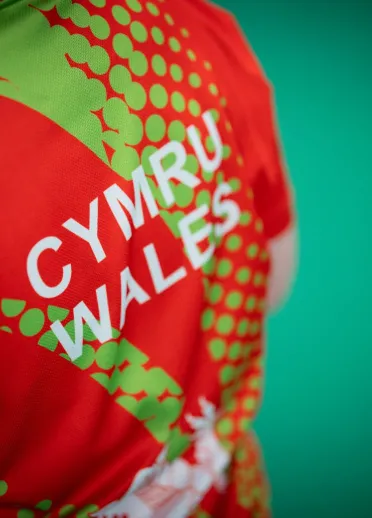 Close up of the Team Wales lawn bowls shirt with "Cymru Wales" on the back.