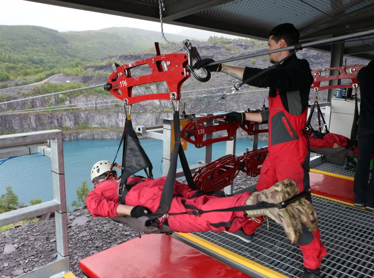 People getting ready to zip wire.
