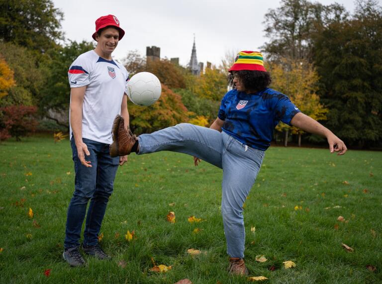 Two people playing with a football.