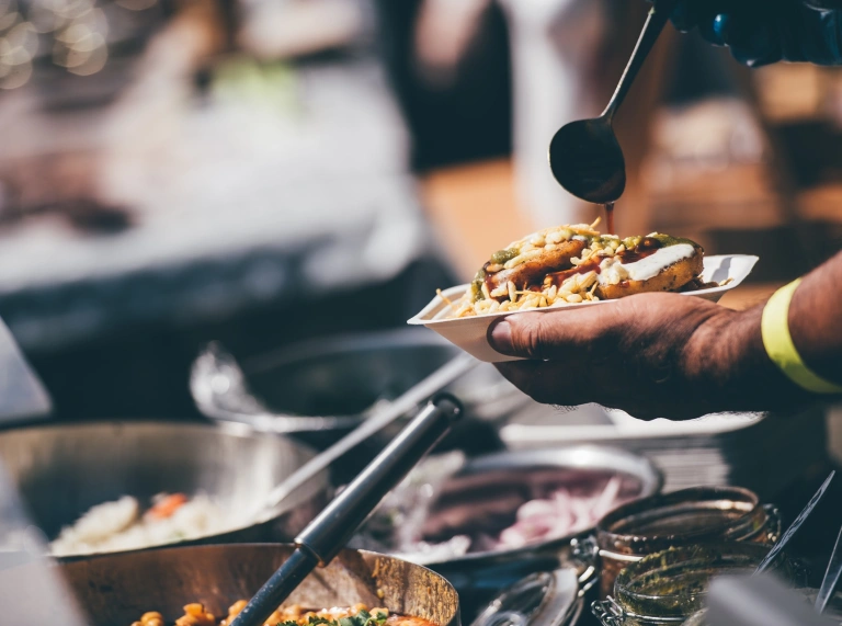 Someone serving a bowl of food.