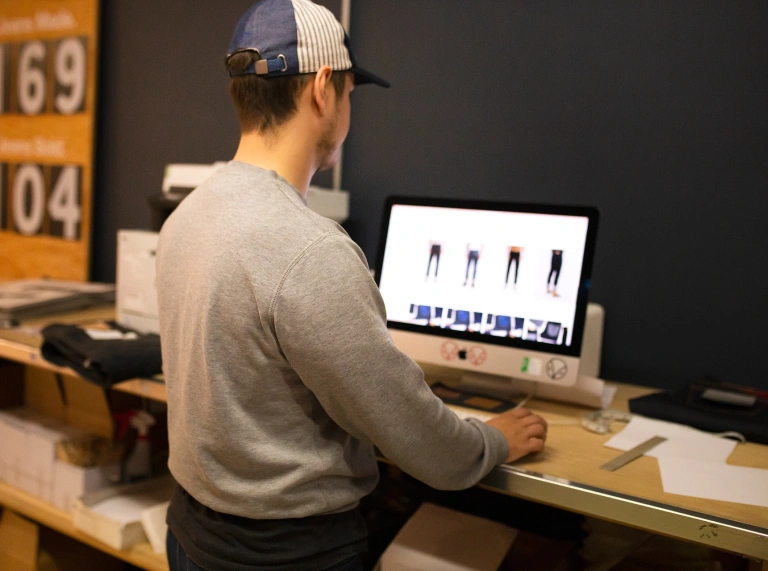 A person standing at a computer