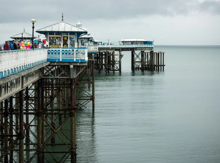 The pier stretching out over the water.
