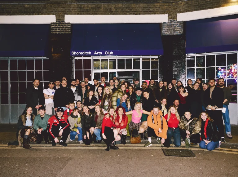 A large group of people smiling