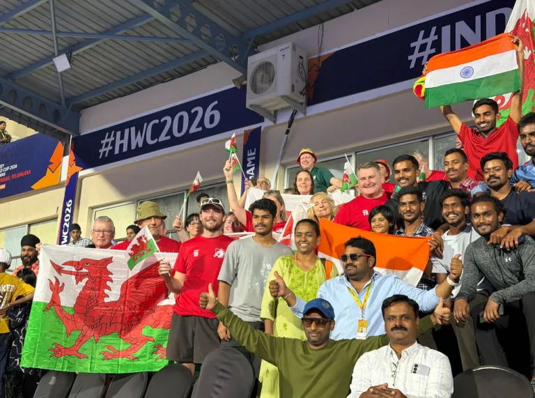 Welsh and Indian supporters celebrate together at the Hockey World Cup qualifiers in Hyderabad.