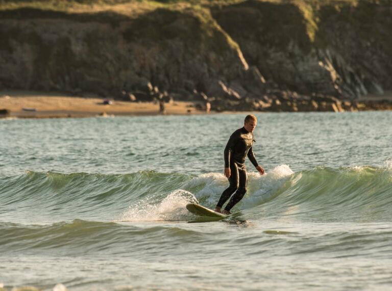 A person surfing in the sea.