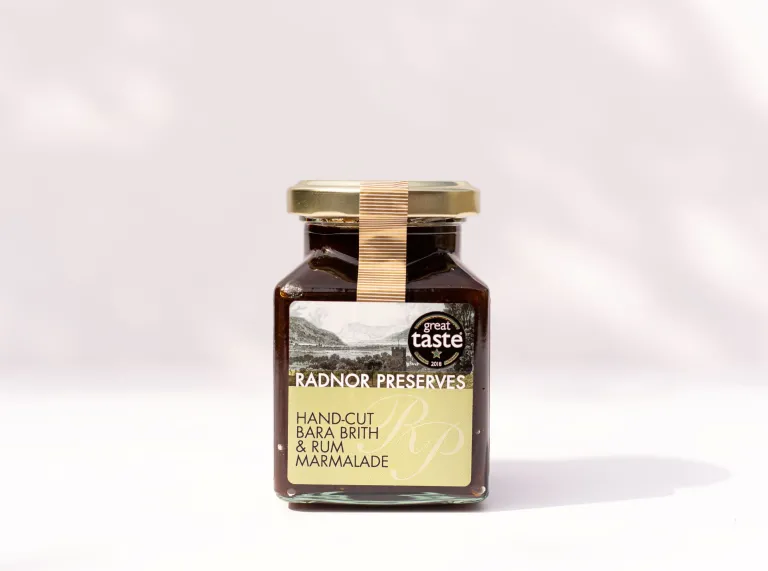 A jar of Radnor Preserves Hand Cut Bara Brith and Rum Marmalade against a white background