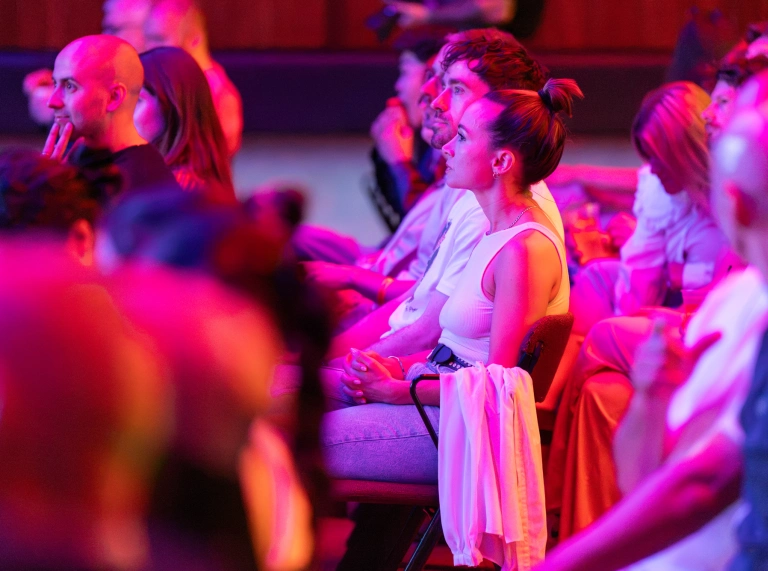 Members of an audience sit together on chairs during a ceremony where Iris revealed its Best British Shorts at New Century Hall, Manchester. 