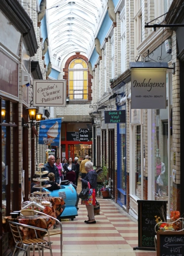 An arcade full of shops.