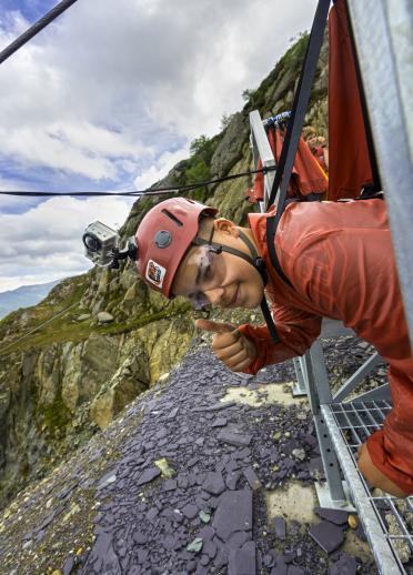 Person preparing to ride a Zip Wire over Penrhyn Slate Quarry