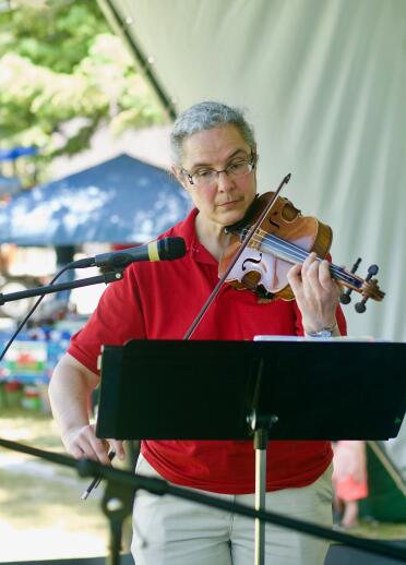 A person playing the fiddle.