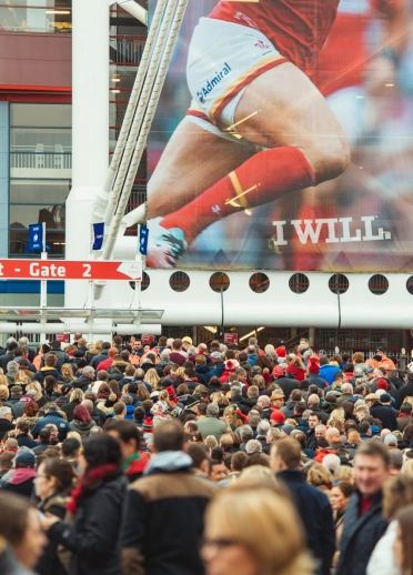 Image of a crowd of rugby fans outside the Principality Stadium.