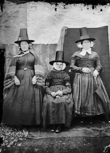 Three women wearing traditional Welsh dress