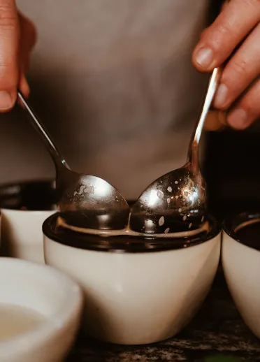Two spoons in a coffee cup