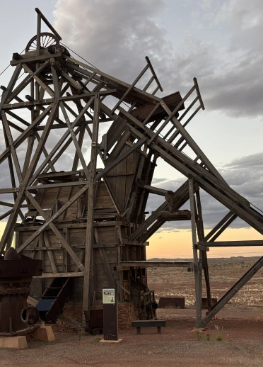A timber incline headframe in Gwalia, Australia, used to lower miners into the ground and hoist gold ore to the surface. 