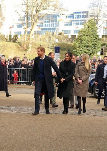 The Duke and Duchess of Sussex, Prince Harry and Meghan Markle walking past crowds at Cardiff Castle