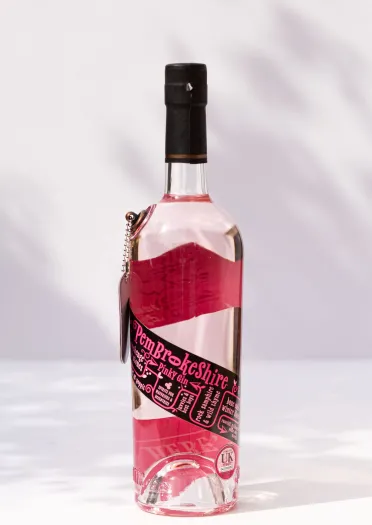 A bottle of Pembrokeshire Pinky Gin against a white background