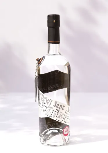 A bottle of Dewi Sant Gin against a white background