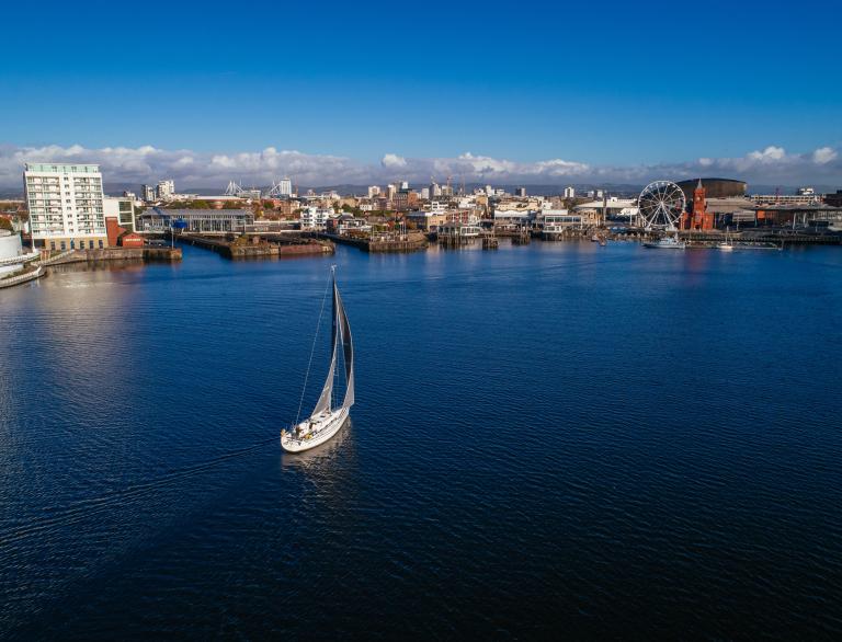 Aerial view of a yacht sailing in  Cardiff Bay