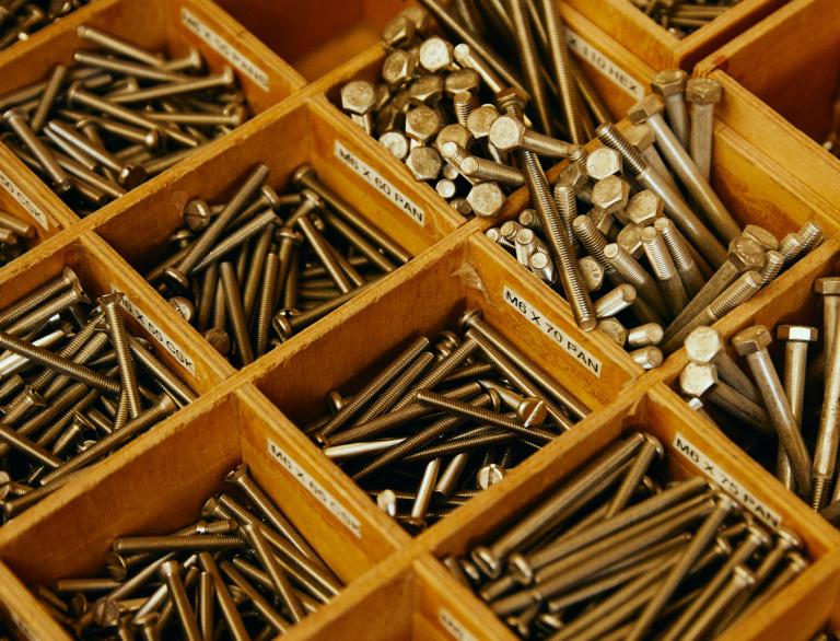 Close up details of nails organised in a tray