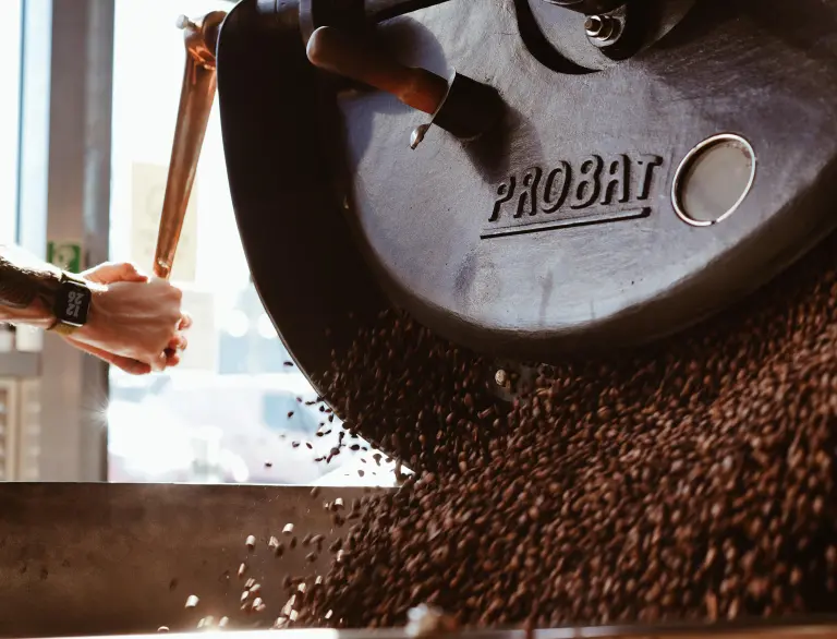 Coffee beans in a roaster.