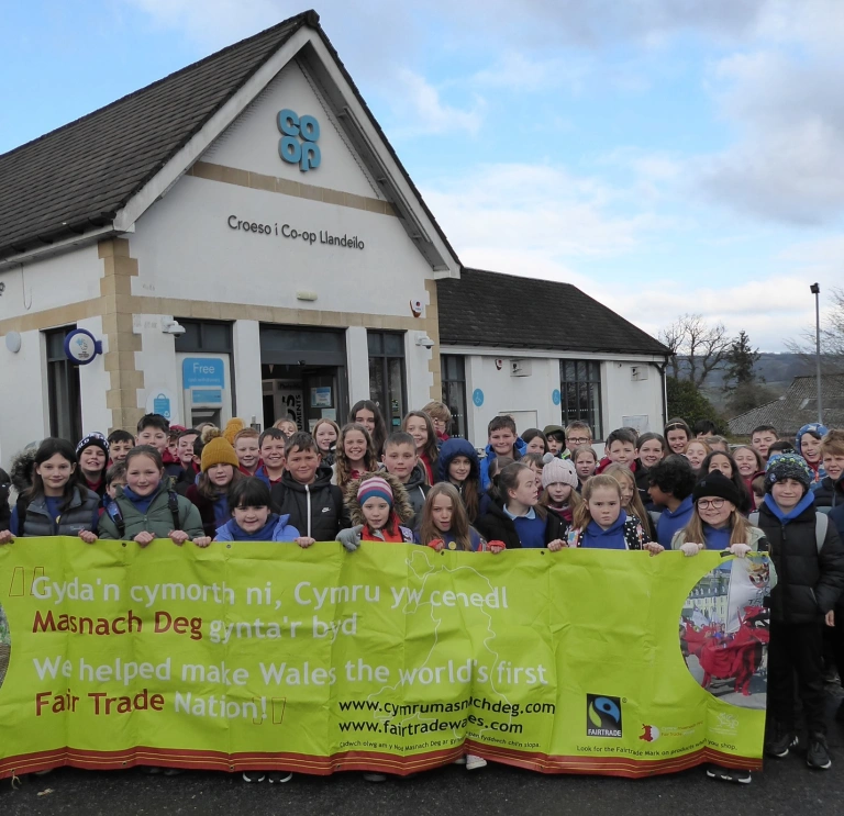 A group of people holding up a Fairtrade banner