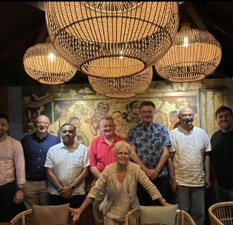 group smiling at camera in India