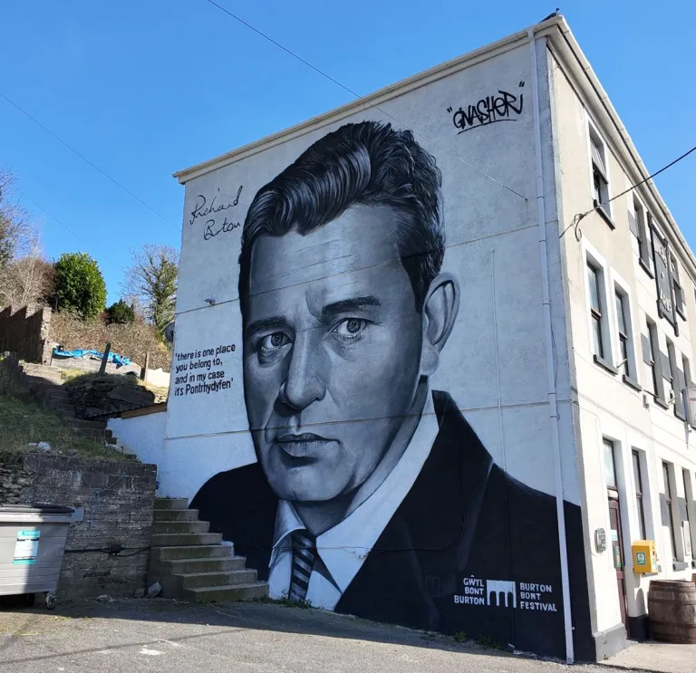 A painting of Richard Burton on the side of a building