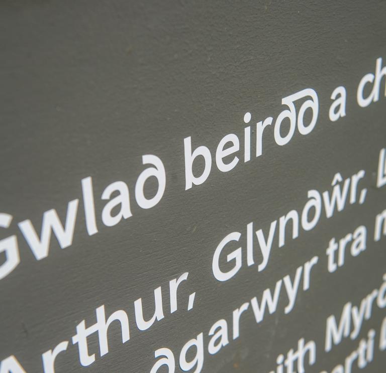 Close up of sign with words in Welsh.