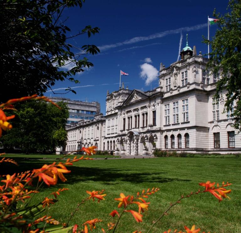 Cardiff University's main building as shown from the outside on a bright sunny day