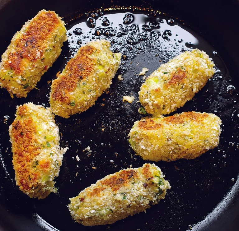 Glamorgan sausages frying in a pan