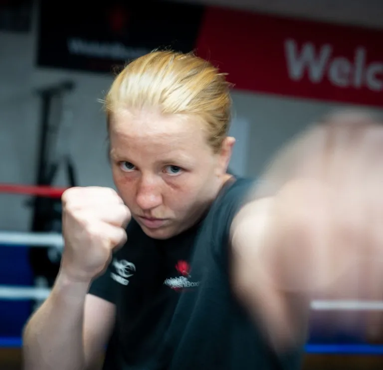 Rosie Eccles throws a punch during a boxing training session in a gym