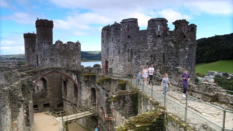 people walking along wall, Conwy Castle