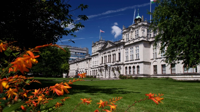 Cardiff University's main building as shown from the outside on a bright sunny day