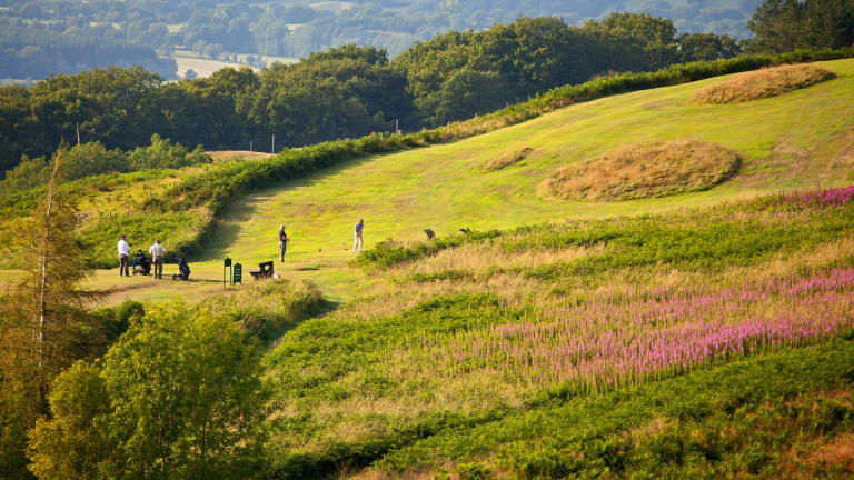 Golfers playing a round with stunning views seen from the height of Llandrindod Wells Golf Club.