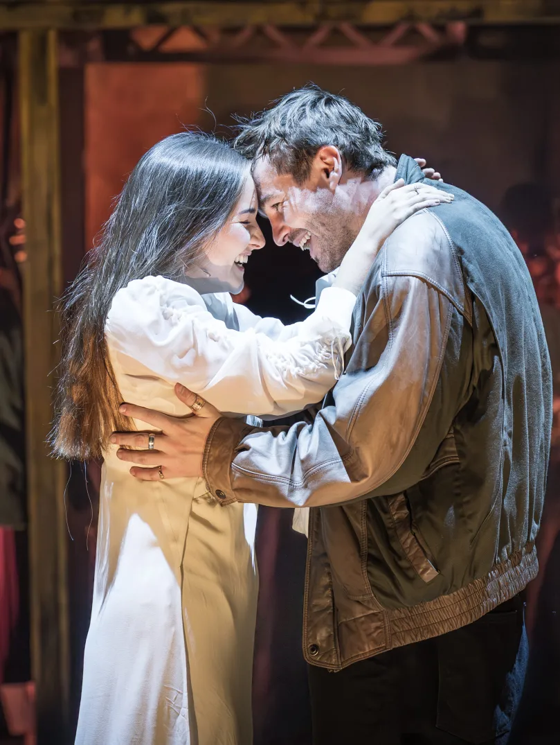 Two actors playing Romeo and Juliet acting on stage