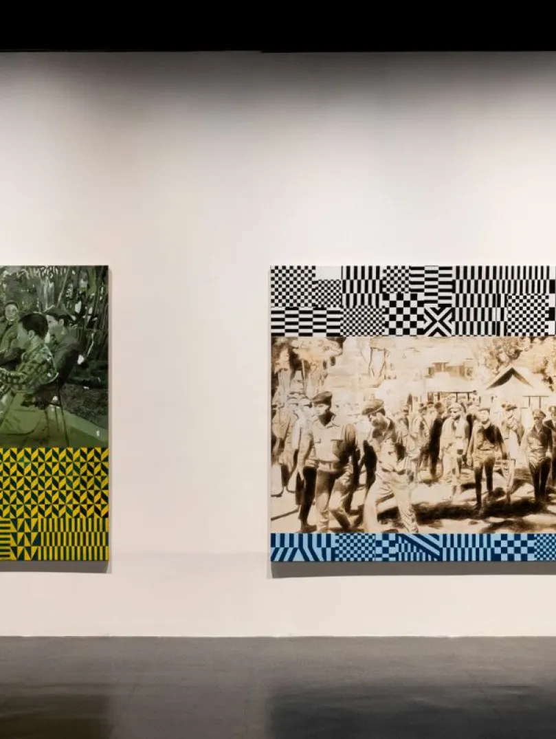 Two large mixed-media artworks hang on a gallery wall, each combining archival-style figurative scenes with bold geometric patterns.